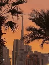Will the DFM Real Estate Index reach 14,000 by 2026?