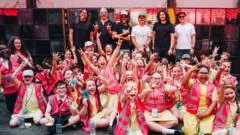Pupils perform for Foo Fighters in stadium show