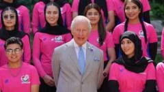 King meets women's cricket team that is not allowed to exist