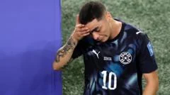 Paraguay's Almiron first player sent off for covering mouth