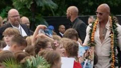 School trip surprise as students meet The Rock