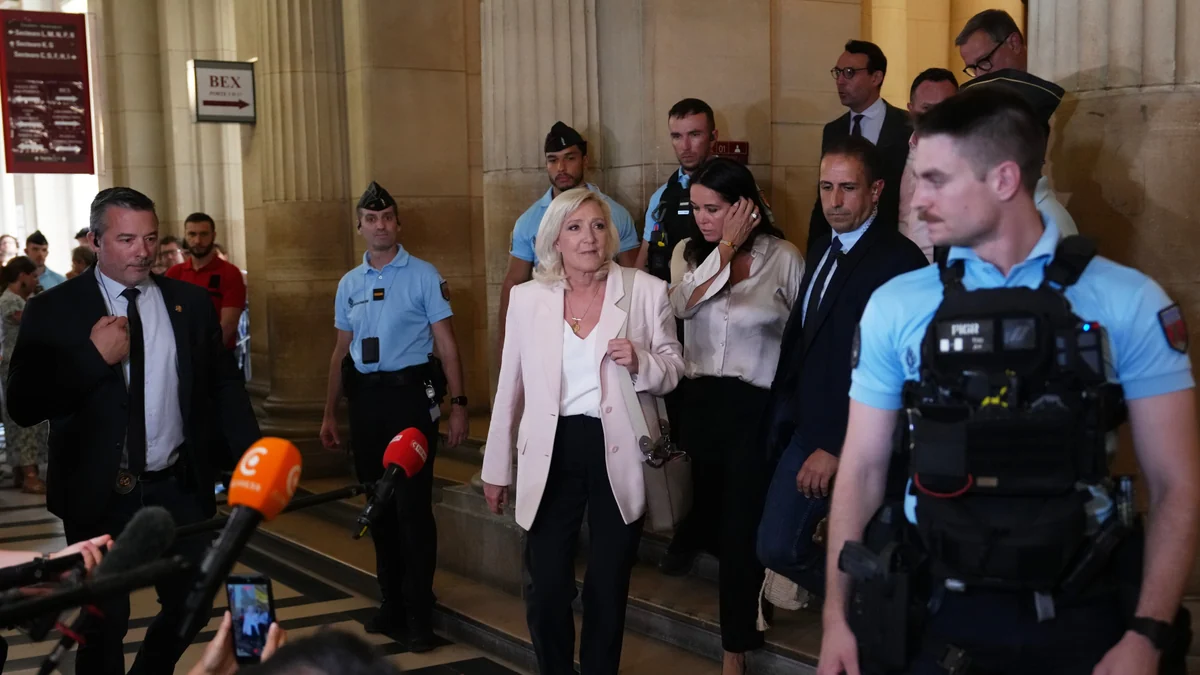 Le Pen says she'll run for French presidency next year despite court-ordered monitor