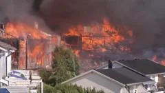 Watch: Helicopters dump water as huge Norway fire destroys homes