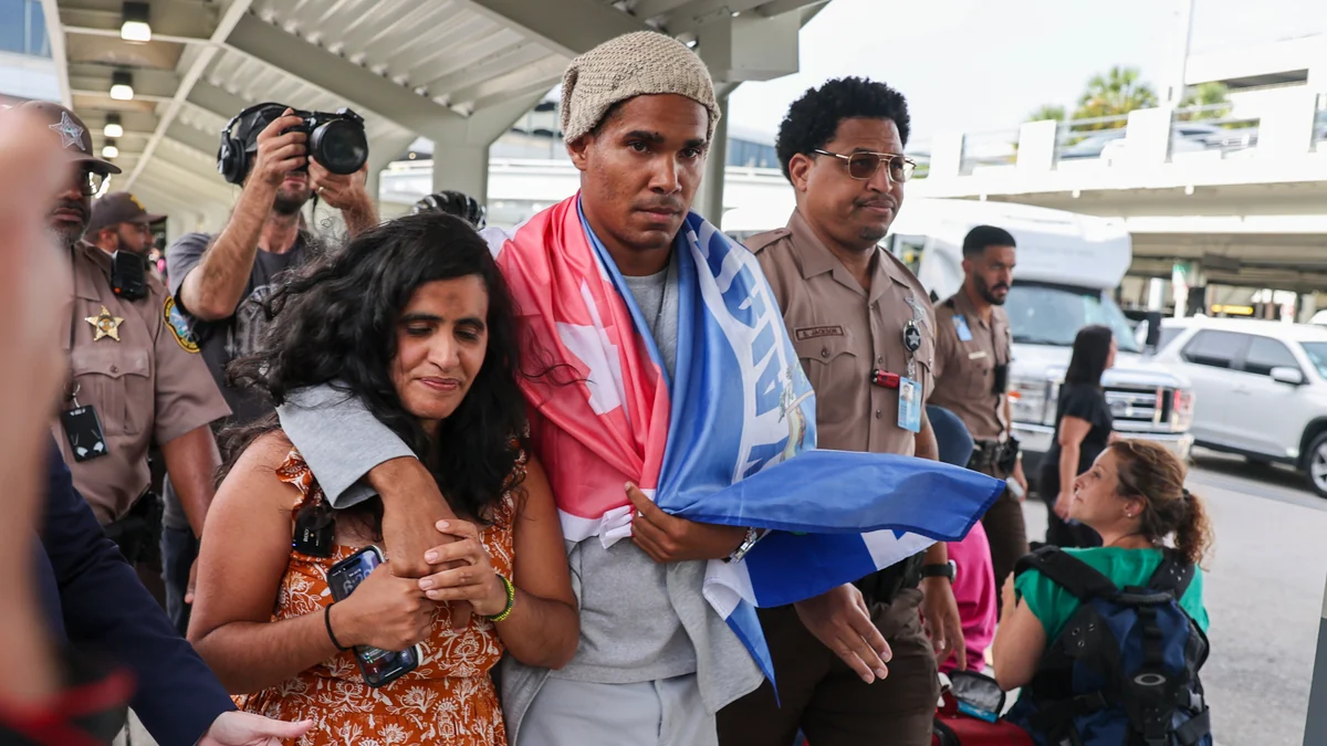 Cuban artist and dissident exiled from country after 5 years in prison arrives in US
