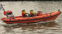 Two men die trying to help children in sea
