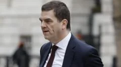Former top official Robbins takes legal action over sacking