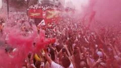 Arsenal fans turn streets red for victory parade