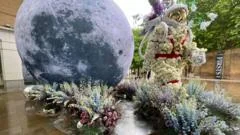 Giant moon and UFO take over Chelsea streets