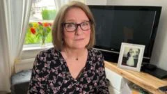 Widow 'distressed' by firm's nine-month delay to husband's pension