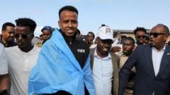 Banned World Cup referee Omar Artan arrives home in Somalia