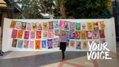 Artist happily reunited with lost tea towel art