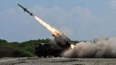 Japan defence minister denies militarism, criticises China's 'huge arsenal'
